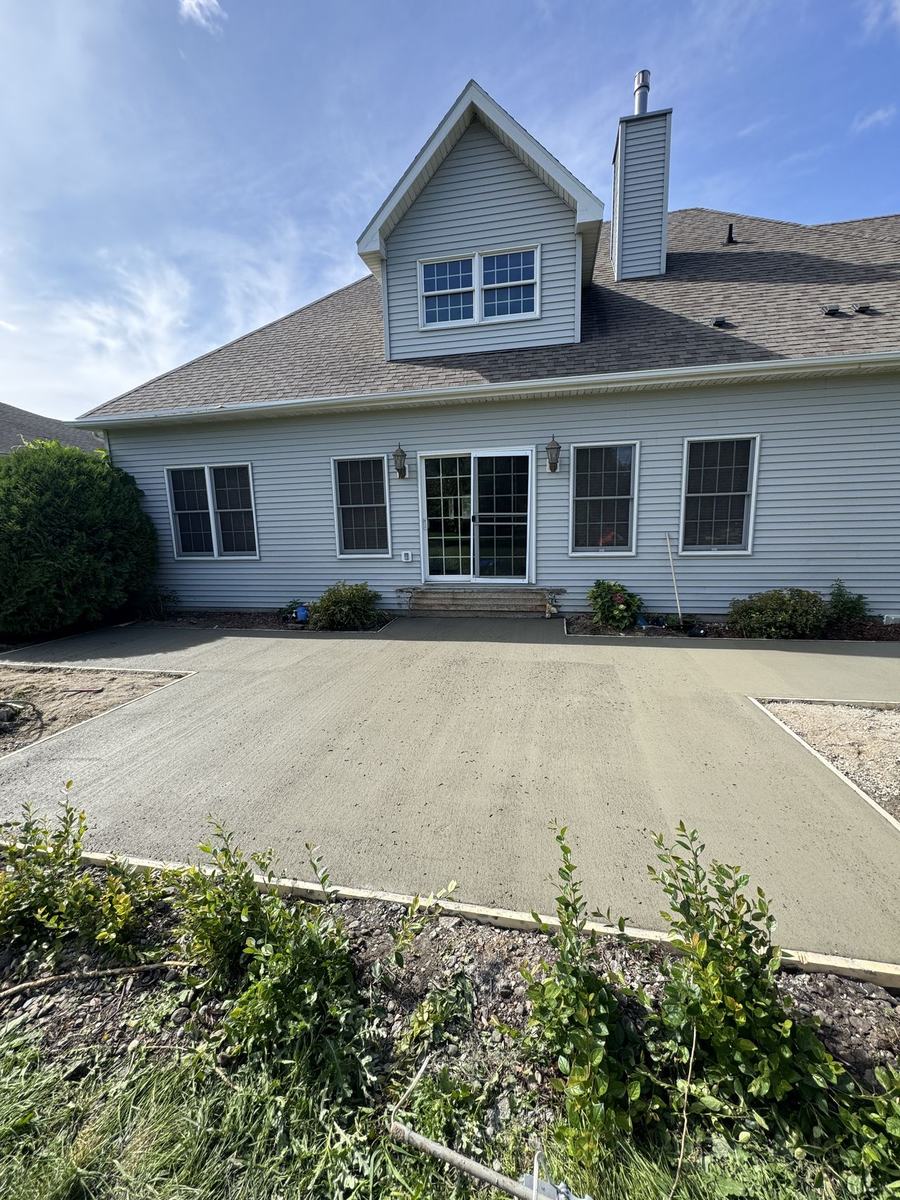 Large new concrete pad replacing the old patio