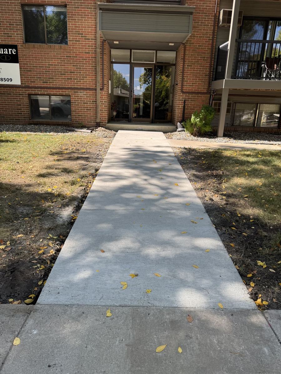 Fresh, level concrete walkway after OARA's work