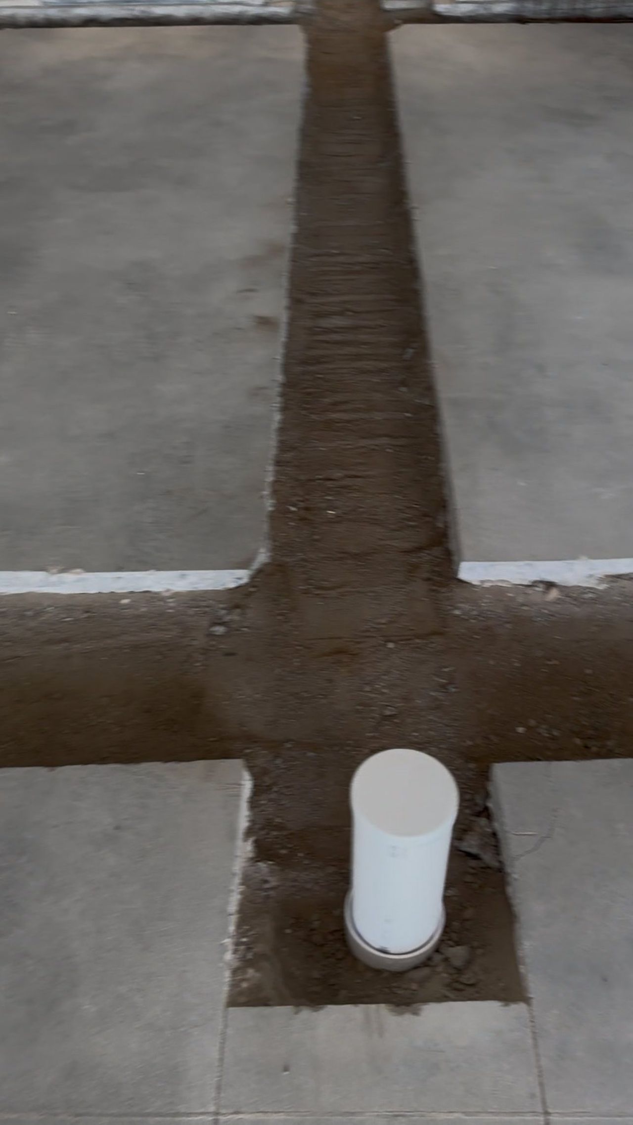 T-shaped slab trench with a new PVC stub-up